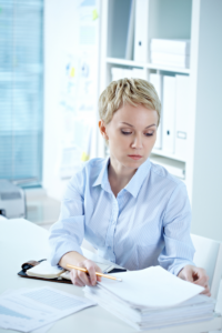 Lady completing paperwork